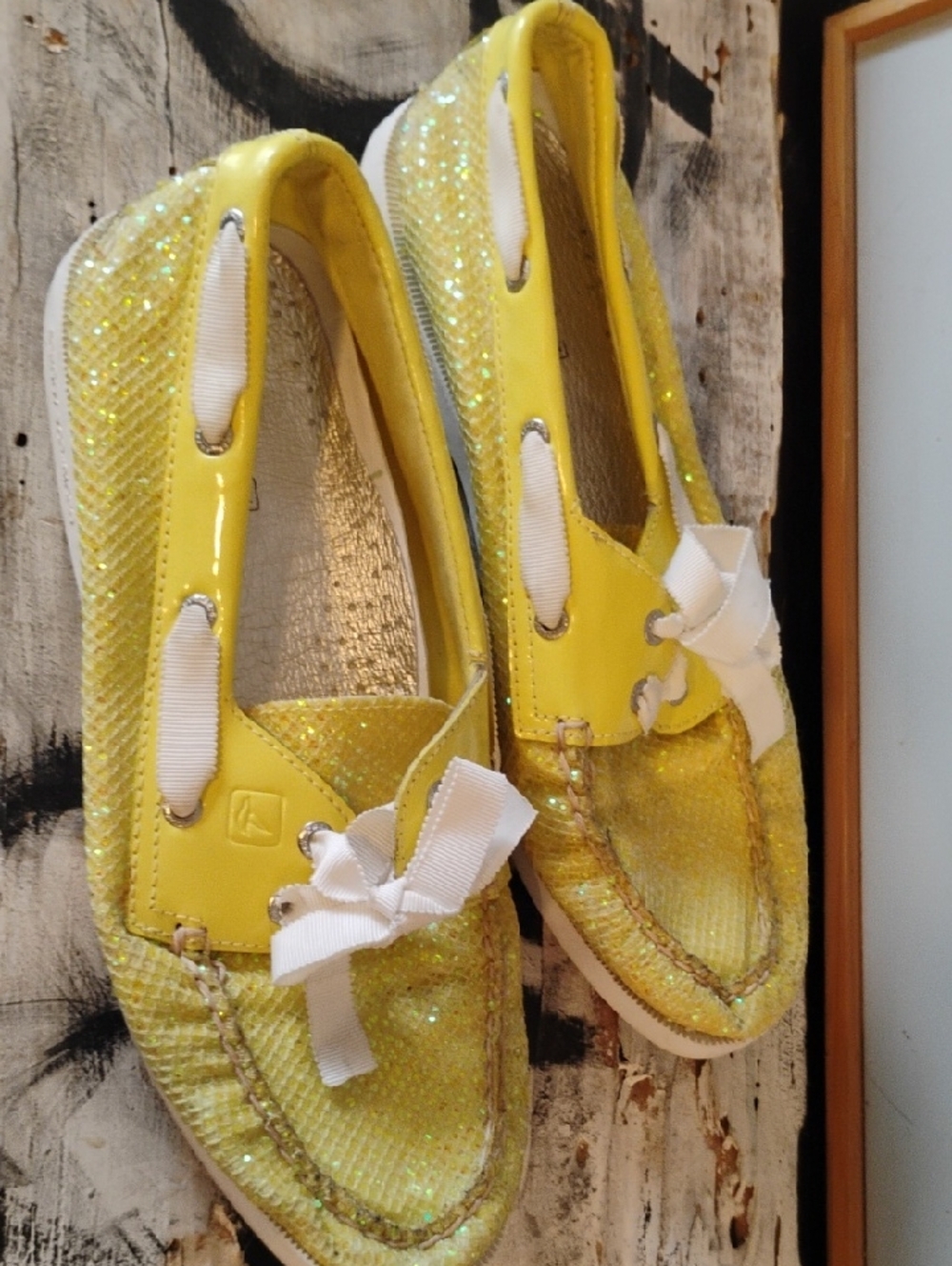 Sperry Yellow Glitter Slip-On Loafers with White Ribbon Laces.